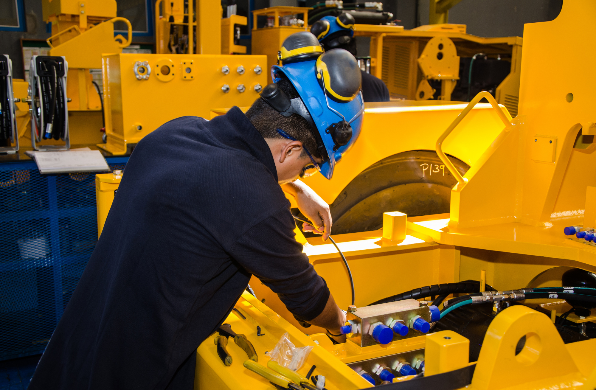 Heavy diesel technician servicing machinery to address the mining workforce shortage in Australia