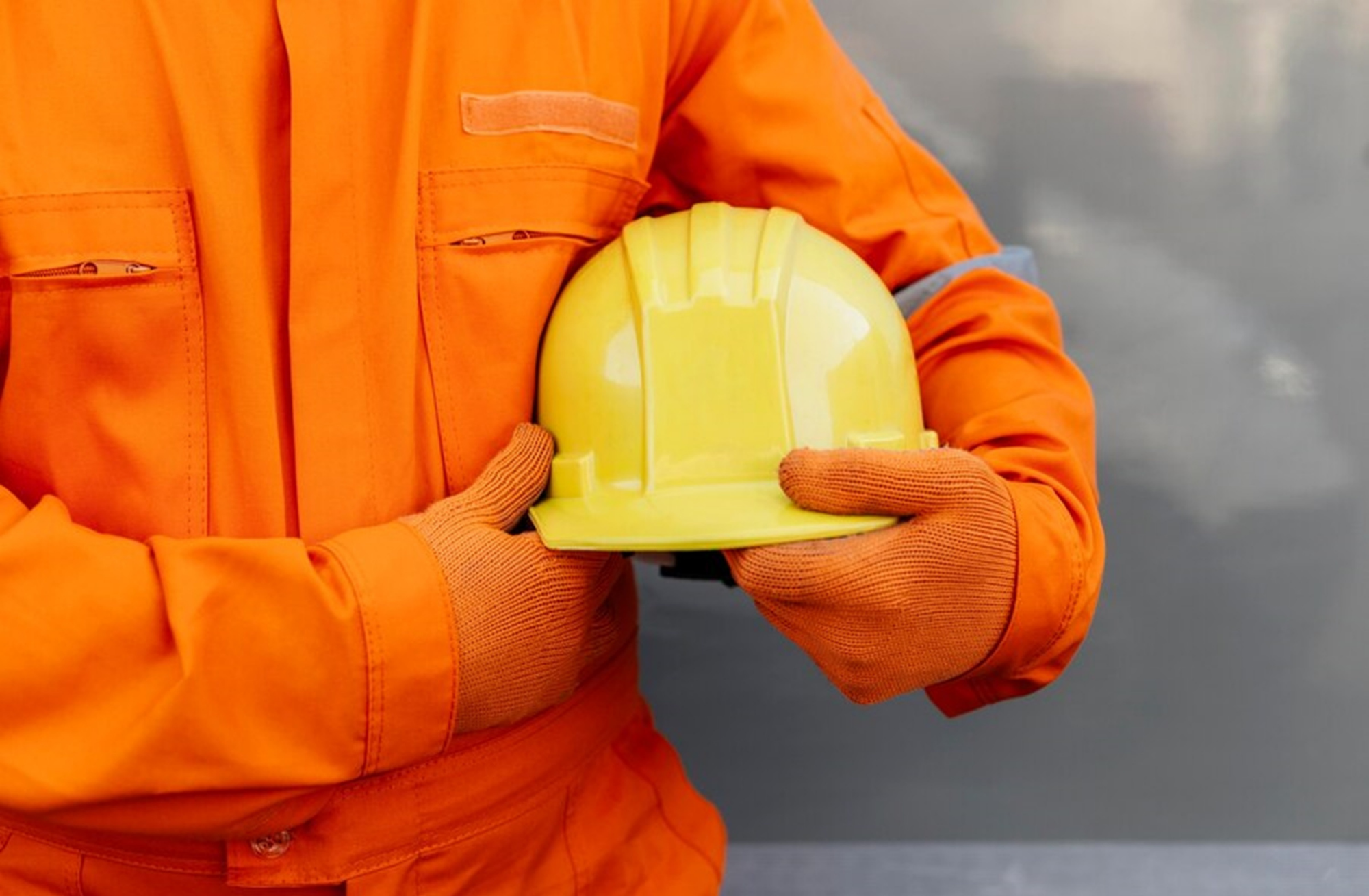 Mining worker holding safety helmet representing mining visa sponsorship in Australia options